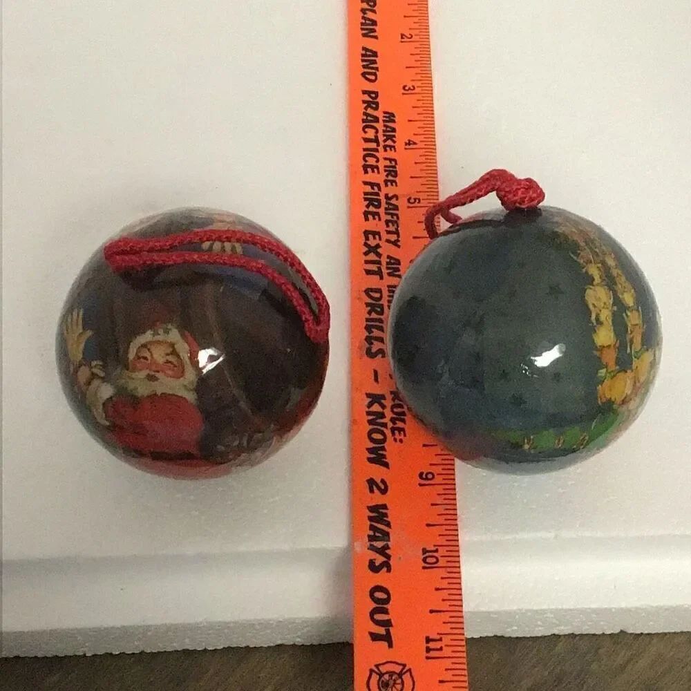 Pair of vintage paper ball Santa Christmas ornaments